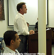 IBI's Mr. Easton (standing) and Mr. Kaira (seated)