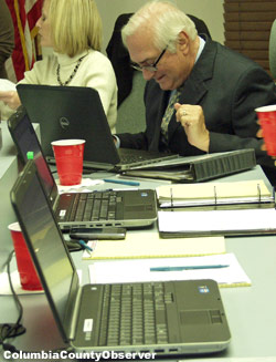With the City Council's laptops lined up like soldiers, Mayor Steven Witt gets ready to bring Lake City into the electronic age.