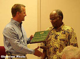 FCWB Chariman, Larry Thompson, presents retiring Bd member, Glynell "the coach" Presley a plaque for distinguished service