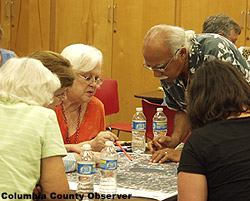 A group puts their heads together.