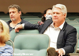 County Econ. Dev. Dir Glen Hunter (rt.) and County Commissioner Toby Witt (back row) listen to the presentation.