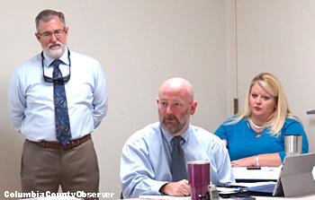 Attorney Joel Foreman (center), Tim Williams (left), Jennifer Goff (right)