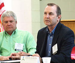 Gilchirst County Commissioner Todd Gray presiding at a NFEDP meeting