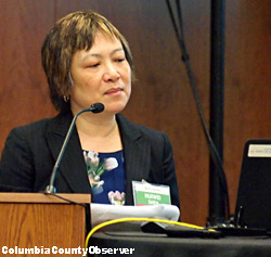 FDOT's Chief Planner Huiwei Shen looking at laptop