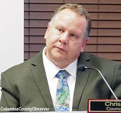 Councilman Chris Greene listens to the evening's proceedings