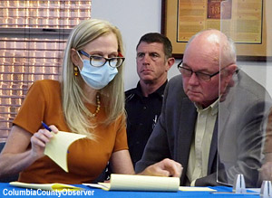 Clerk Sikes and Interim City Manager Mike Williams tally the secret ballots.