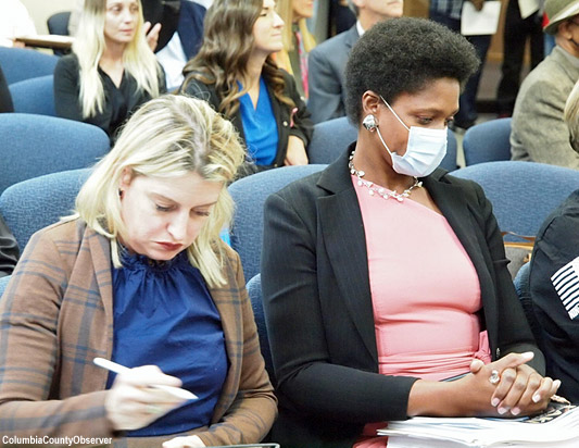 Befaithful Coker with her attorney Natalie Kato as the meeting got underway.
