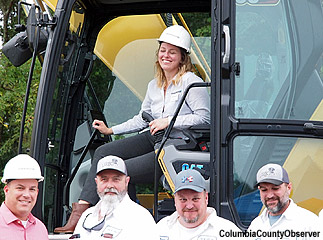 Engineer Jamie Bell at the controls of a giant excavator