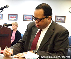 Lake City City Manager candidate Thomas Thomas takes notes.