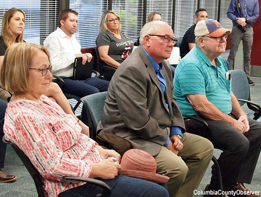 Mike Williams (center) with wife Laurie and Uncle Johnny (Johnny Bryant) listen to President Barrett. Mr. Williams explained that his Uncle Johnny has been instrumental in his life from the beginning.