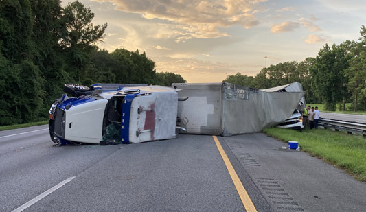 FHP photo showing I-75 blocked by tractor-trailer on its side