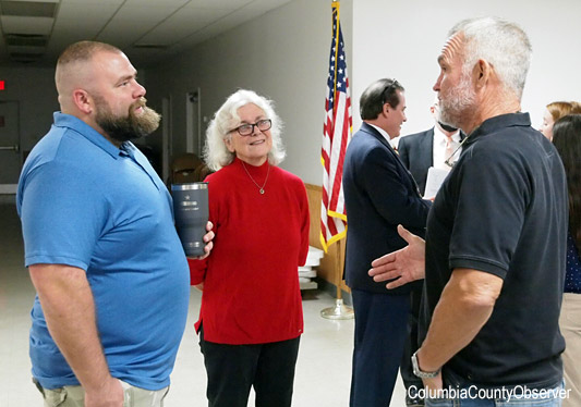 Fort White Mayor Ronnie Frazier talks with High Springs City Commissioner Tristan Grunder and  Alachua County Commissioner Marihelen Wheeler.