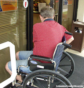 The entrance to the LSHA HQ difficult to open from a wheel chair.