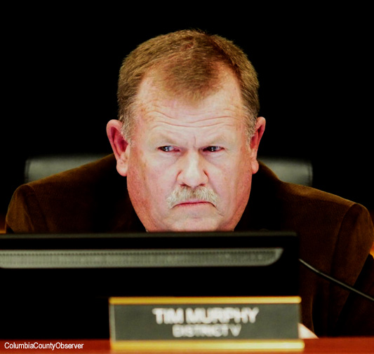 Commissioner Tim Murphy studies the agenda (file)