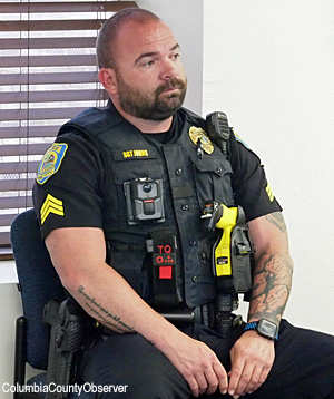 LCPD Sgt. Johns sits watch during a Lake City City Council meeting.