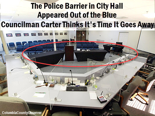 Lake City City Hall with police barrier disguised as tables.