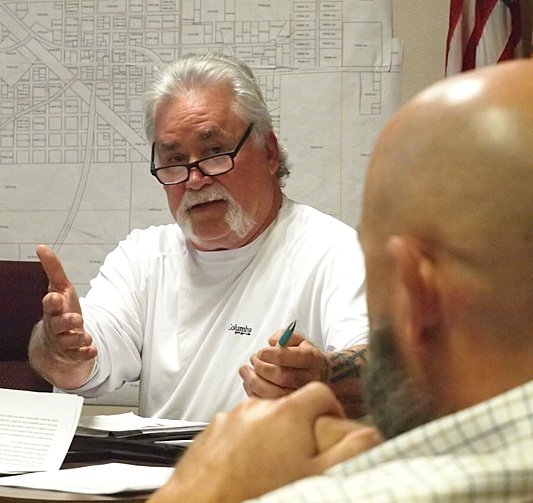 Bill Koon asks a question of the Town Attorney