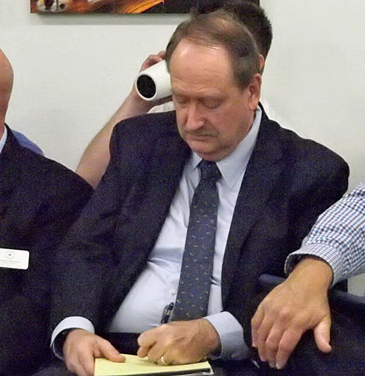 Joe Helfenberger takes notes before his NFWUA interview