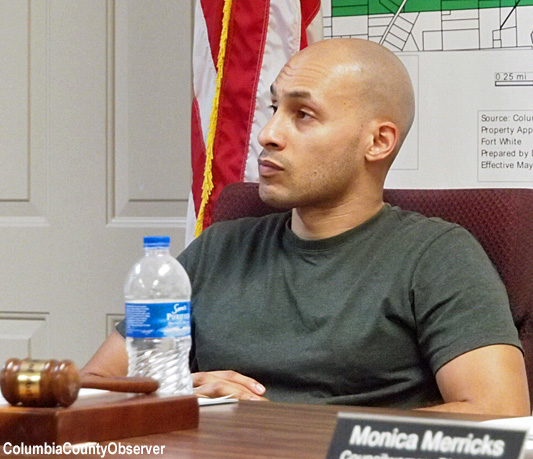 Mayor George Thomas listens to Mike New of Woodard & Curran