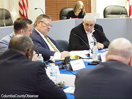 the main focus of this photo is attorney Todd Kennon three feet away from the microphone