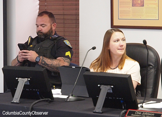 Inside the chamber Sgt. Johns was protecting the left Council flank. City Finance Director Angie Taylor looks on.