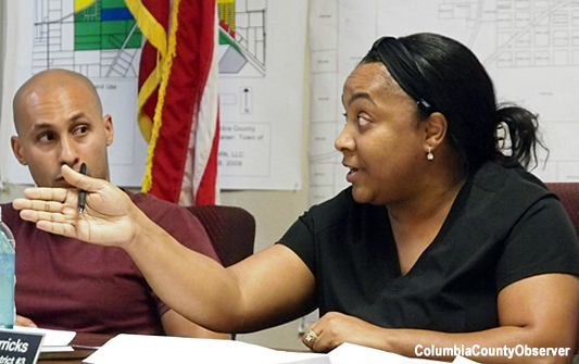 Councilwoman Monica Merricks questions Council members Harrell and Terry about when the changes were made to the Hunter contract.