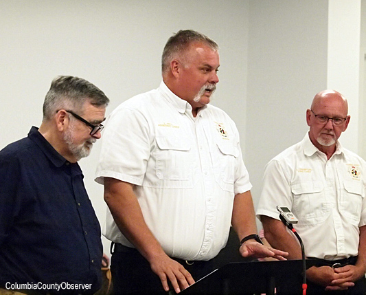 Lance Hill (center), David Kraus (left), Jeff Crawford (center): the County hands-out-team.